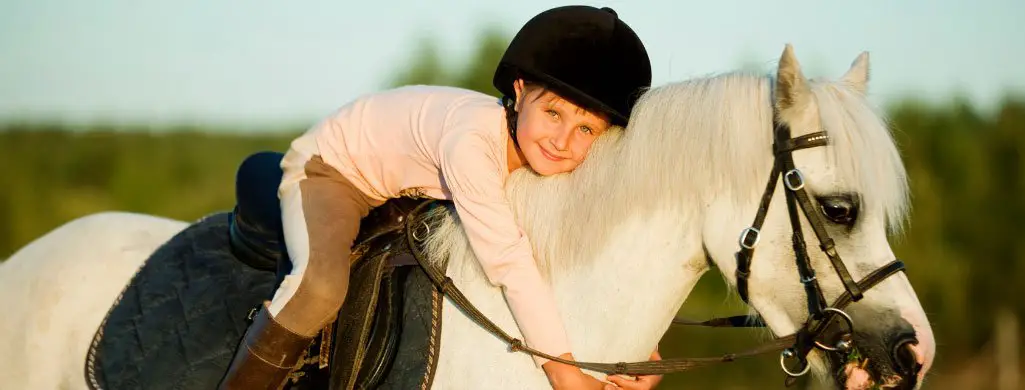 Young Girl Hugging Horse